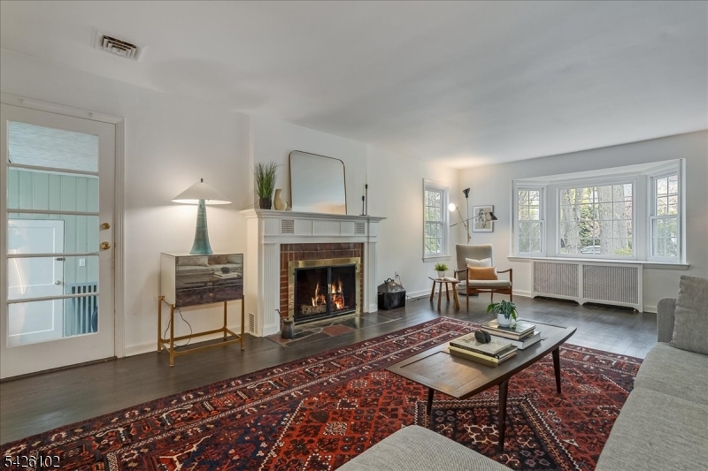 8 Lessing Road West Orange, NJ 07052 - Photo 16 of 40 a living room with furniture and a fireplace