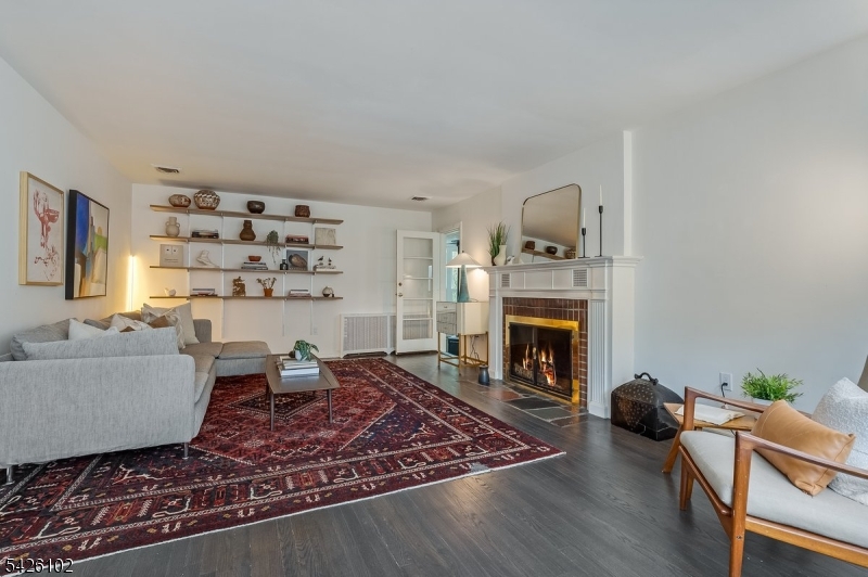 8 Lessing Road West Orange, NJ 07052 - Photo 17 of 40 a living room with furniture and a fireplace