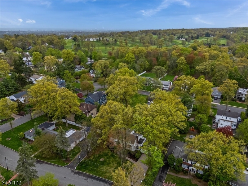 8 Lessing Road West Orange, NJ 07052 - Photo 36 of 40 an aerial view of residential houses with outdoor space and trees