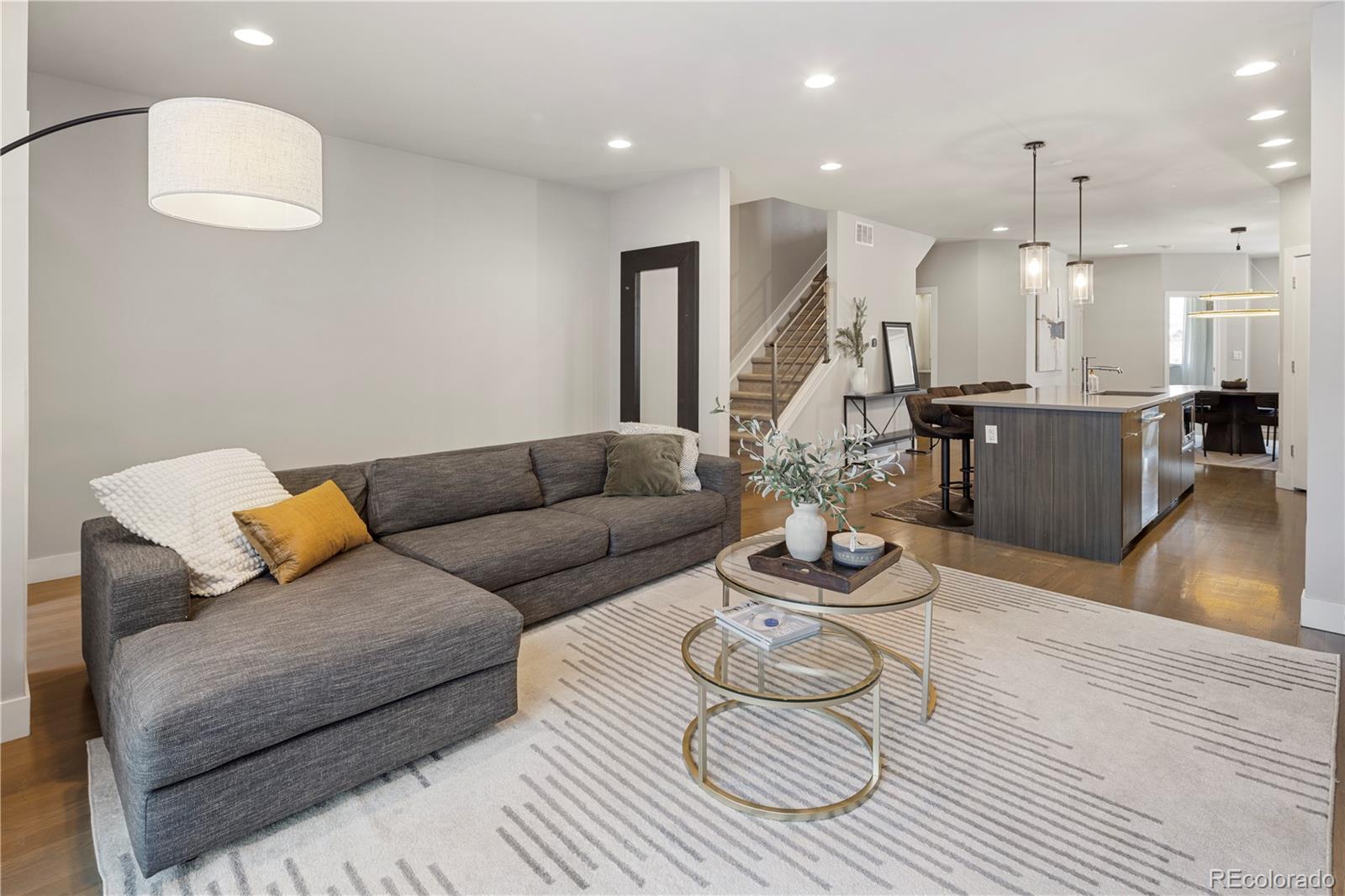1815 Grove Street Denver, CO 80204 - Photo 11 of 36 a living room with furniture and wooden floor