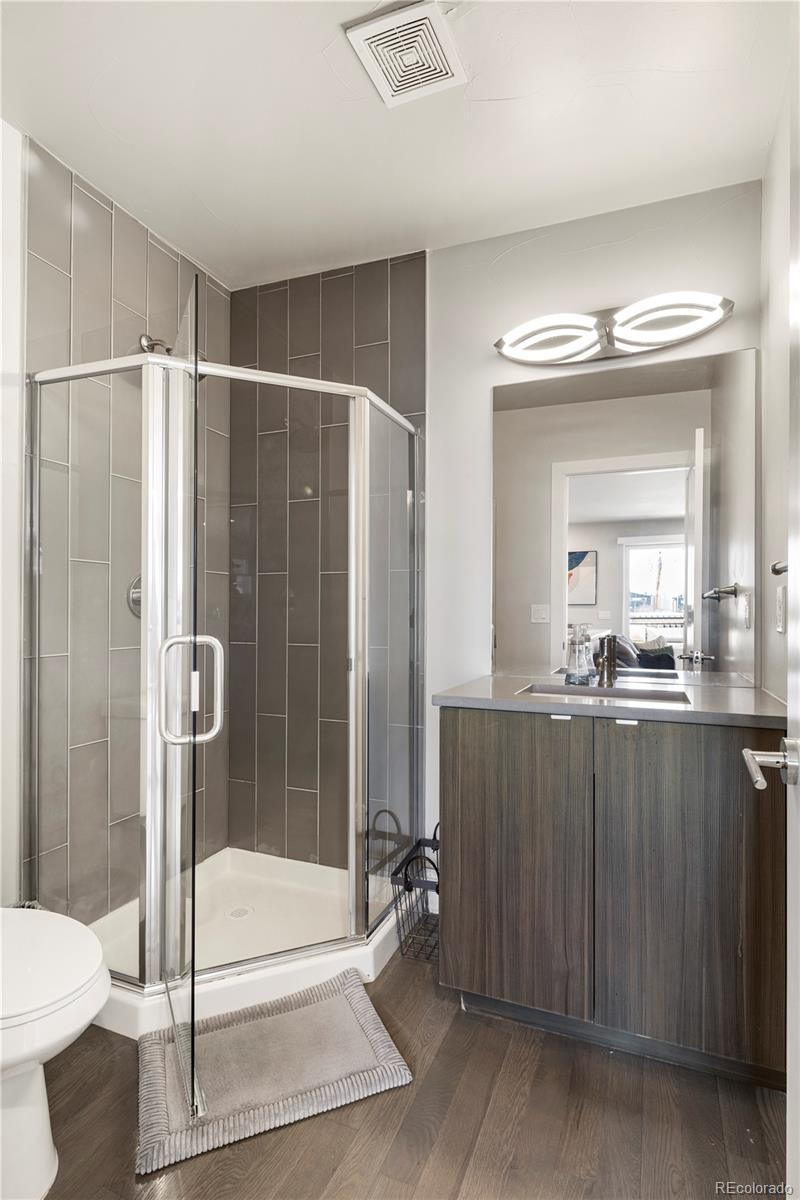 1815 Grove Street Denver, CO 80204 - Photo 24 of 36 a bathroom with a shower and a sink