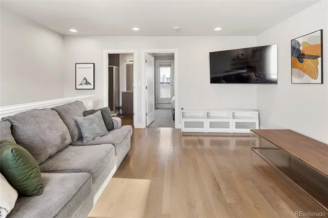a room with lots of residential buildings and wooden floor