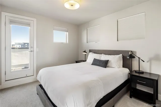 a view of a balcony with an outdoor seating