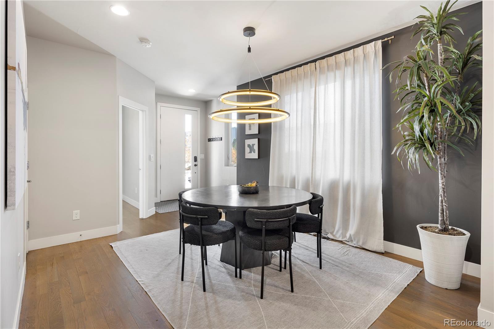 1815 Grove Street Denver, CO 80204 - Photo 5 of 36 a dining room with furniture and window