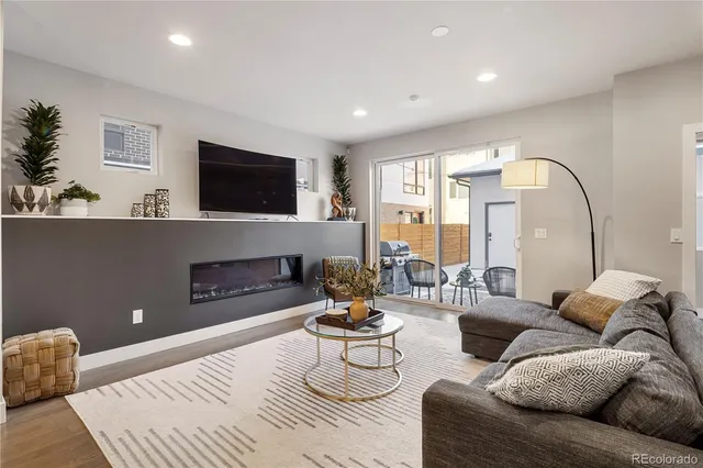 a living room with furniture fireplace and a flat screen tv