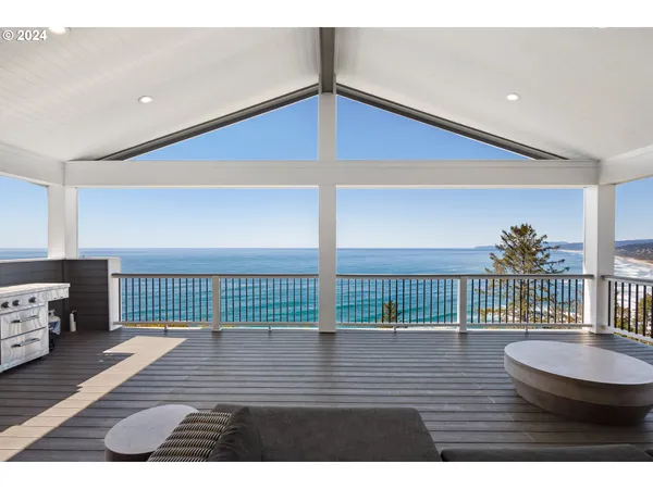 a view of a balcony with furniture