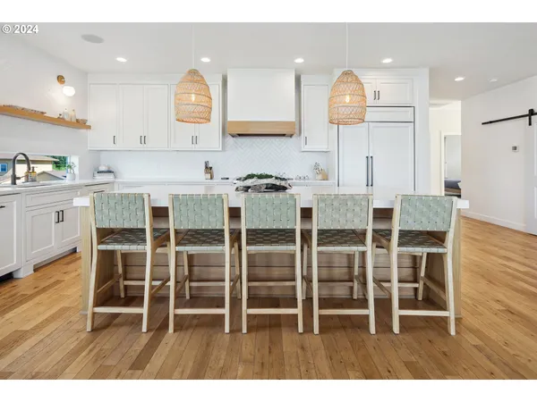 a kitchen with a table and chairs in it
