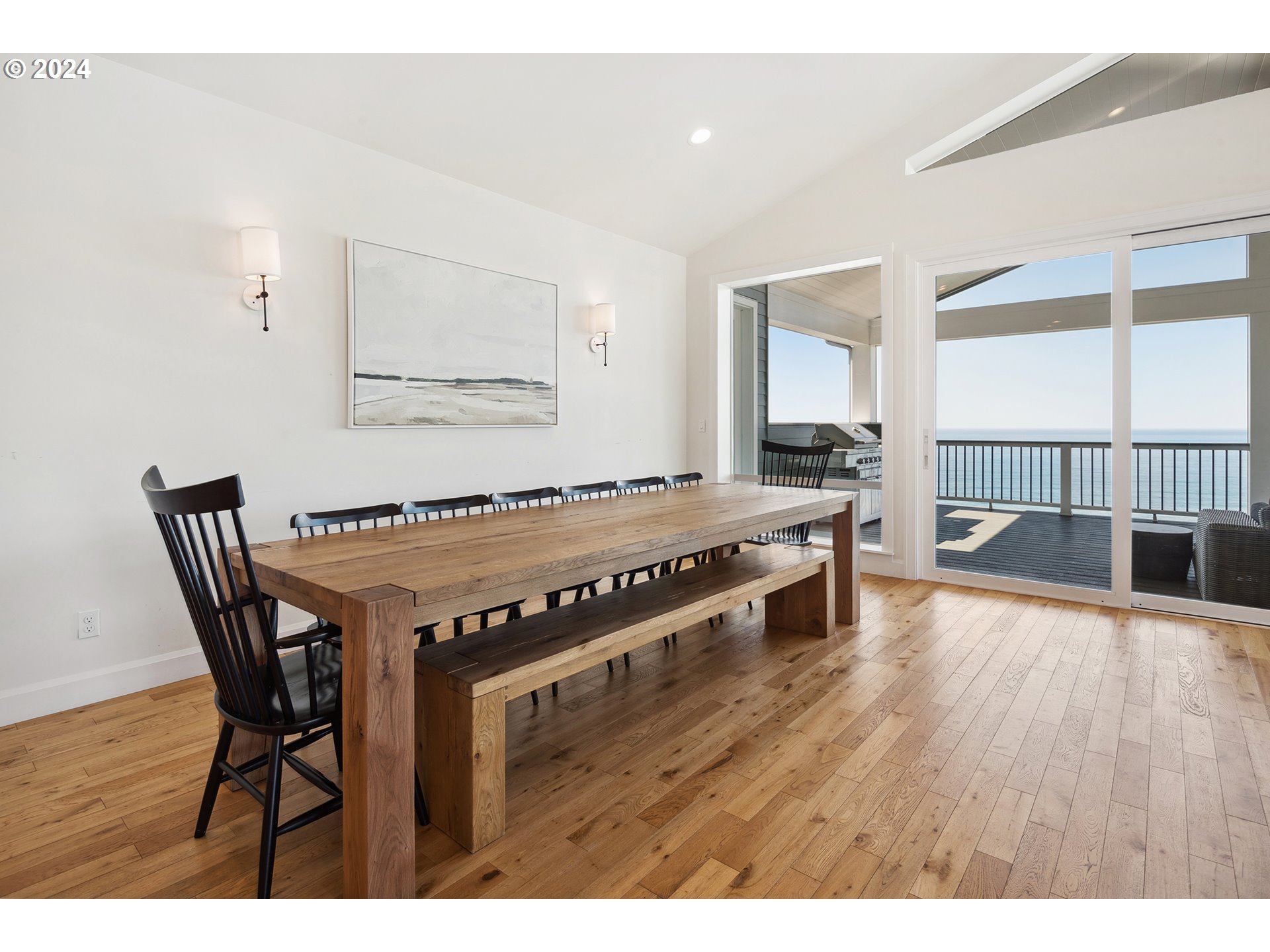 54150 South Beach Road Neskowin, OR 97149 - Photo 22 of 48 a view of a dining room with furniture and wooden floor