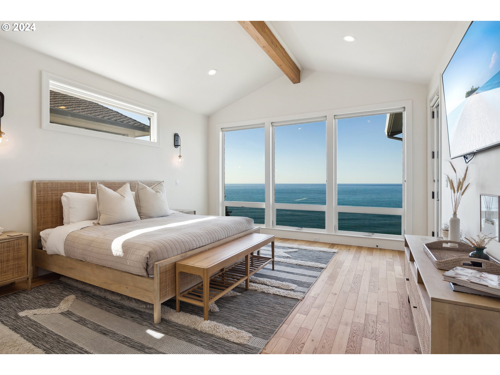 54150 South Beach Road Neskowin, OR 97149 - Photo 24 of 48 a bedroom with a bed and a large window