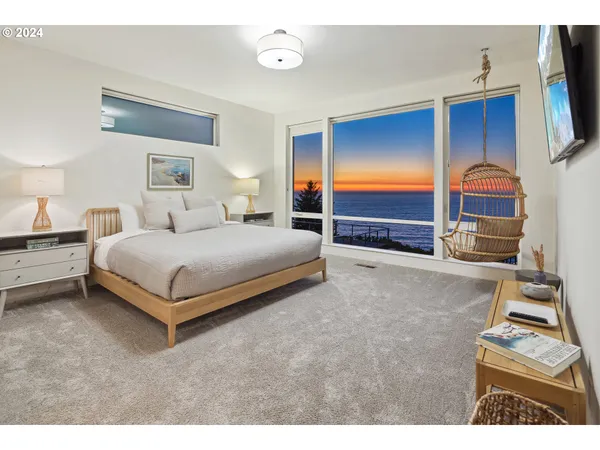 a bedroom with a bed and a painting