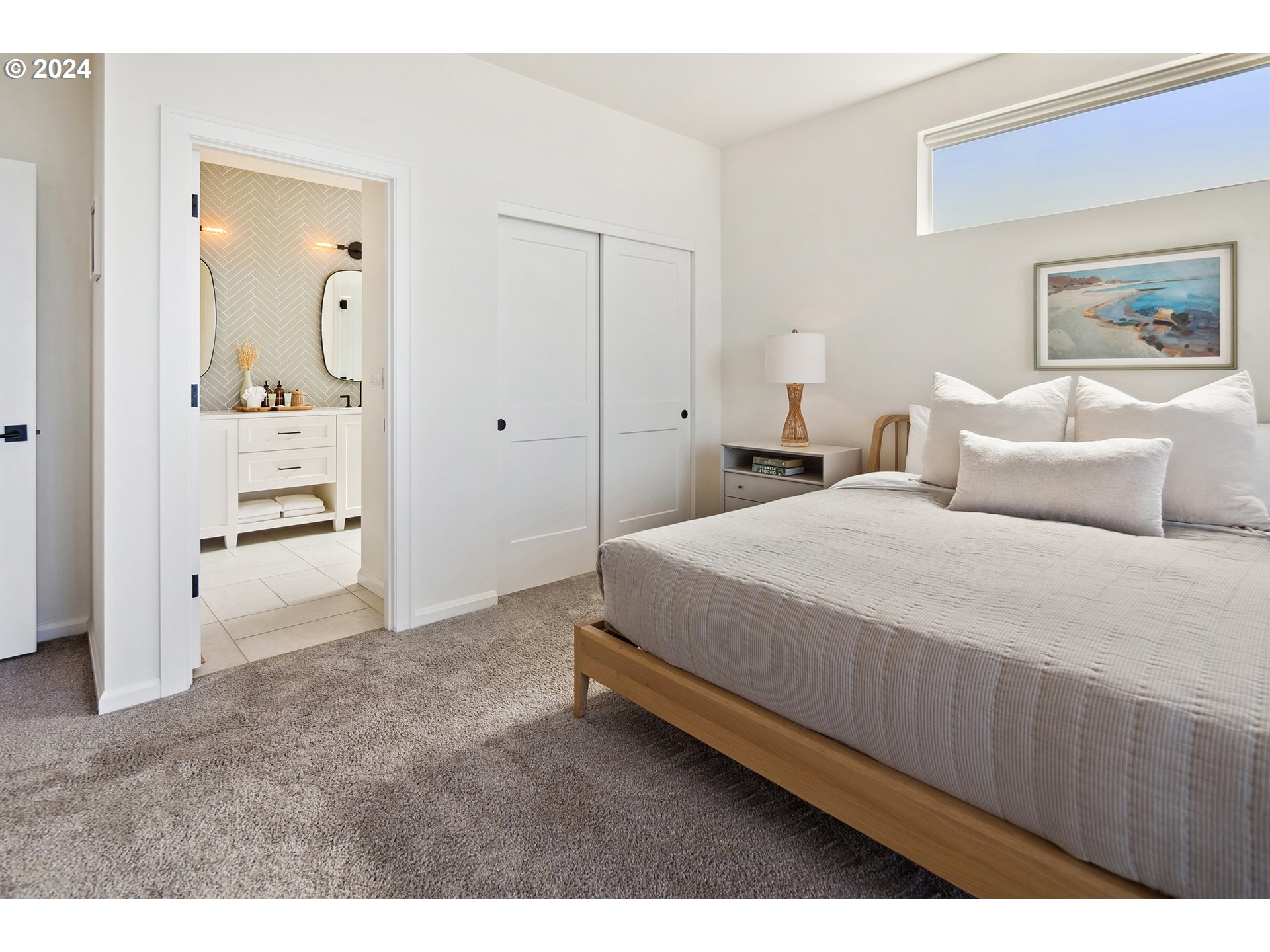 54150 South Beach Road Neskowin, OR 97149 - Photo 31 of 48 a bedroom with a bed and a painting