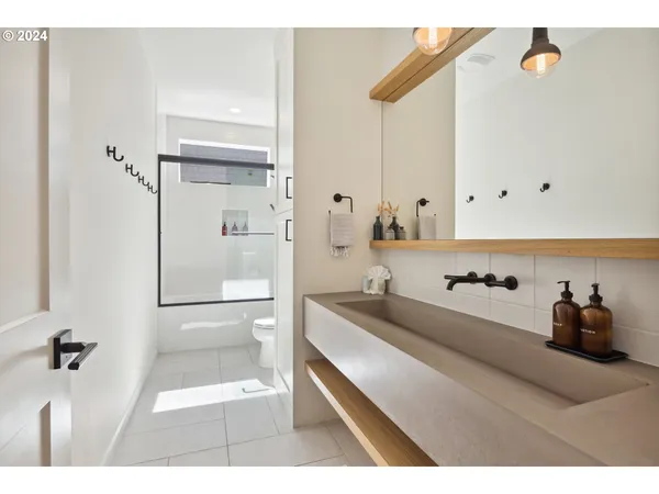 a bedroom with a large bed and a large window