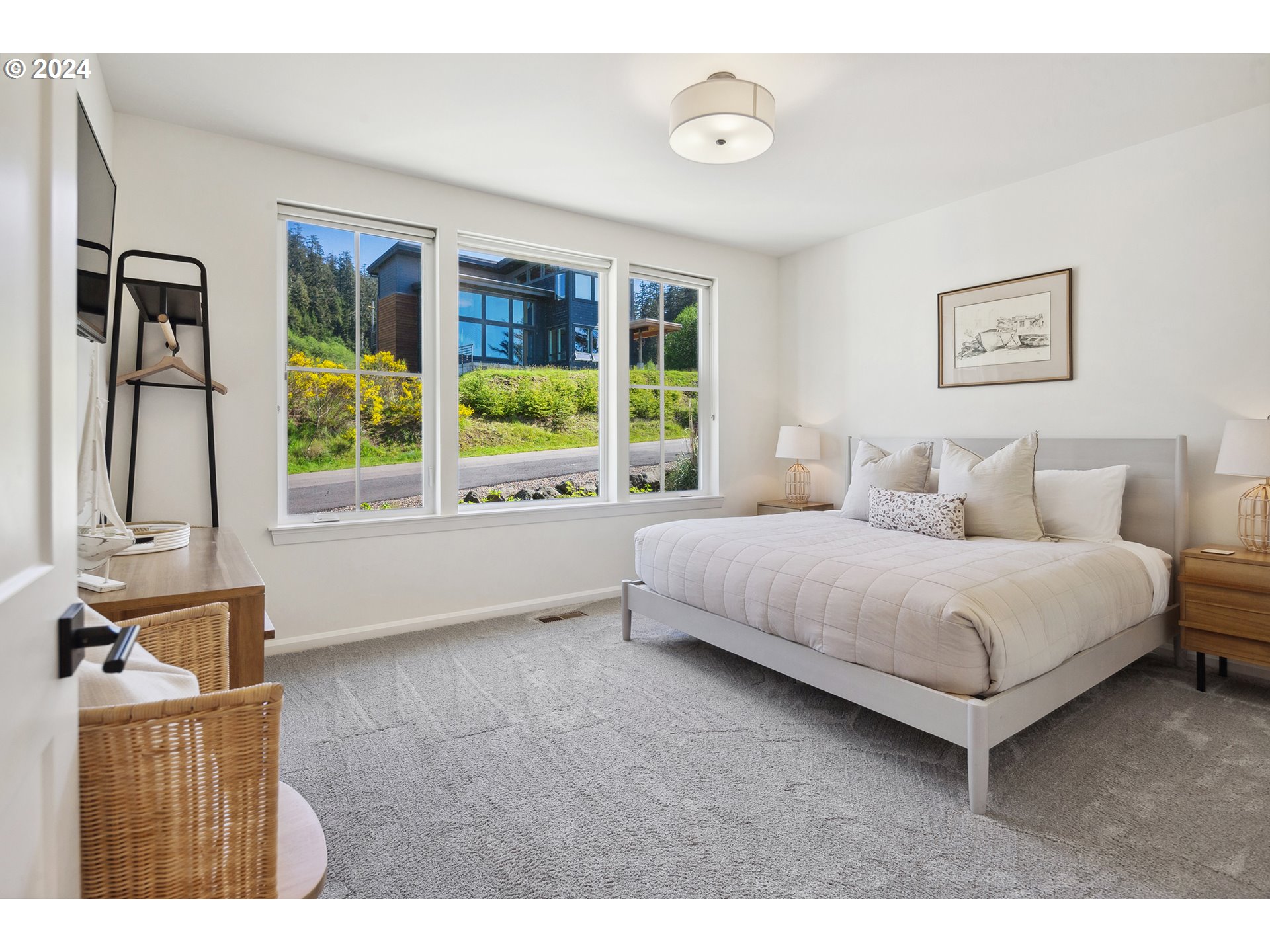 54150 South Beach Road Neskowin, OR 97149 - Photo 35 of 48 a bedroom with a bed painting and window
