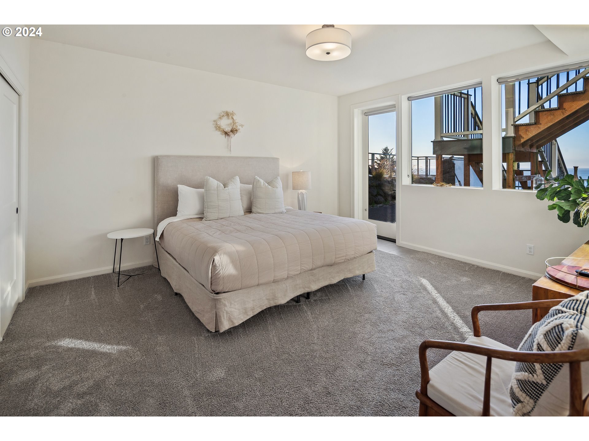 54150 South Beach Road Neskowin, OR 97149 - Photo 36 of 48 a bedroom with a bed furniture and a book shelf