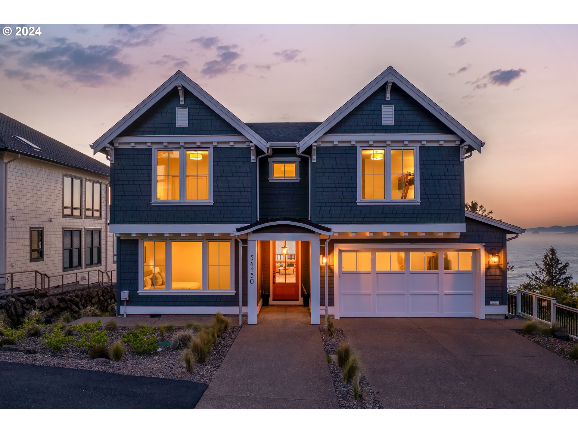 54150 South Beach Road Neskowin, OR 97149 - Photo 46 of 48 a front view of a house with a yard
