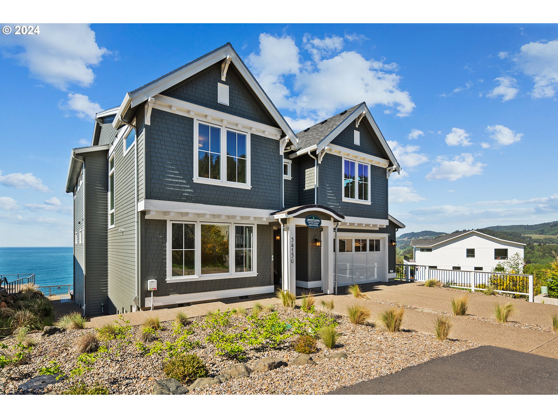 54150 South Beach Road Neskowin, OR 97149 - Photo 48 of 48 a front view of a house with a yard