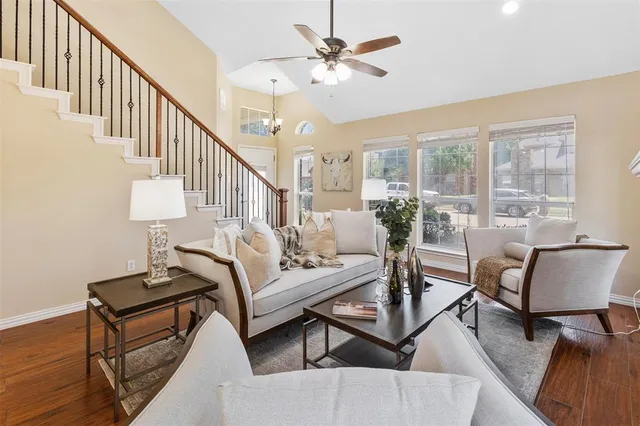 a living room with furniture and a lamp