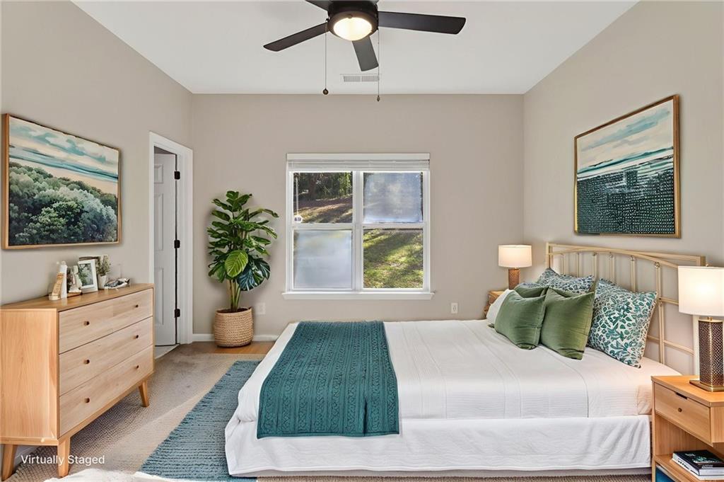 991 Ada Avenue Northwest Atlanta, GA 30318 - Photo 19 of 32 a bedroom with a large bed and a window