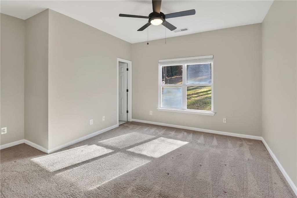 991 Ada Avenue Northwest Atlanta, GA 30318 - Photo 20 of 32 a view of an empty room with a window