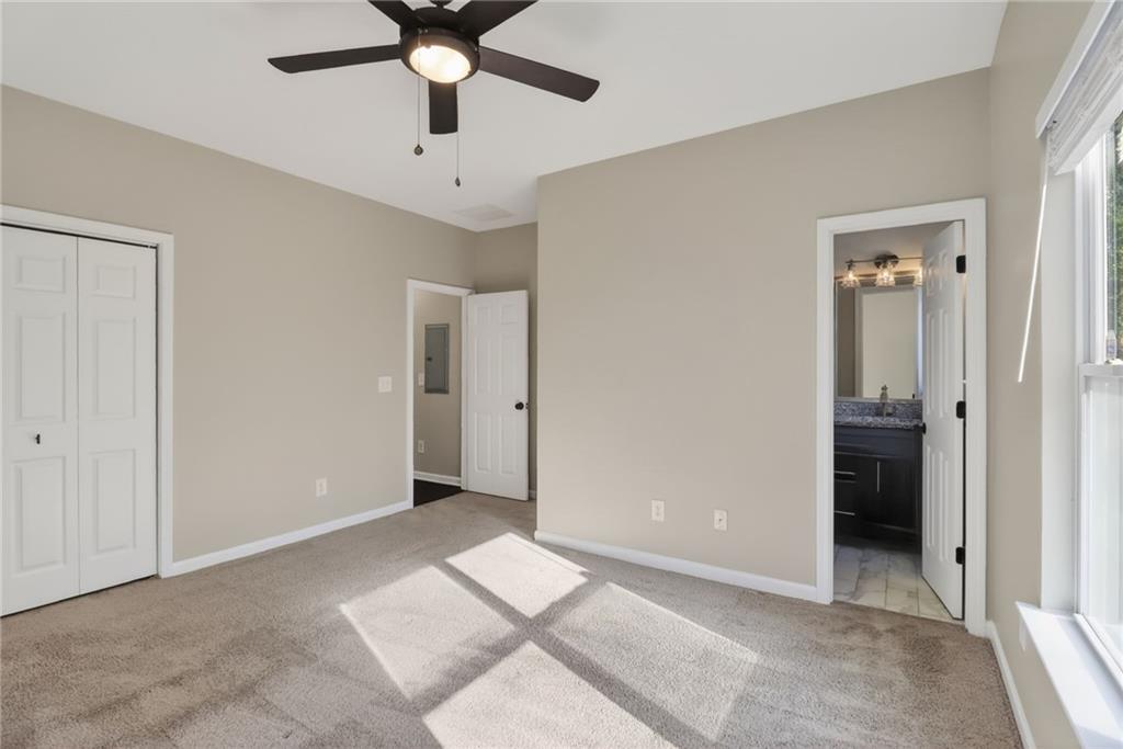 991 Ada Avenue Northwest Atlanta, GA 30318 - Photo 21 of 32 a view of an empty room with a ceiling fan