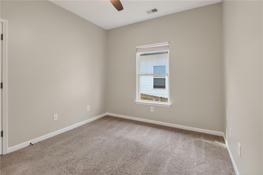 991 Ada Avenue Northwest Atlanta, GA 30318 - Photo 23 of 32 an empty room with a window