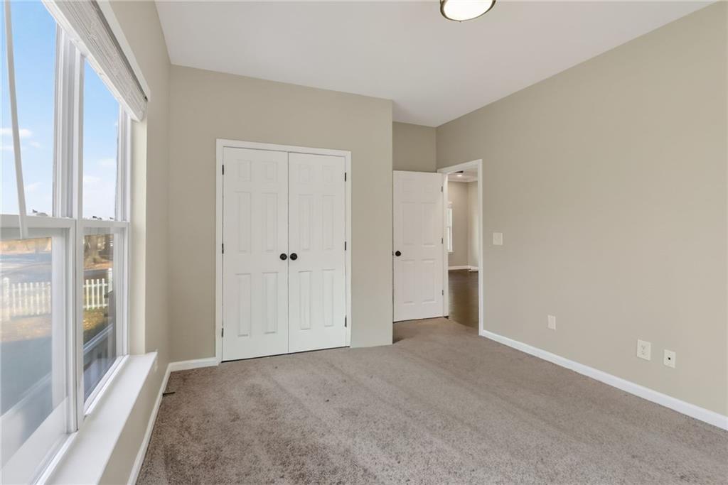 991 Ada Avenue Northwest Atlanta, GA 30318 - Photo 26 of 32 a view of an empty room with a window