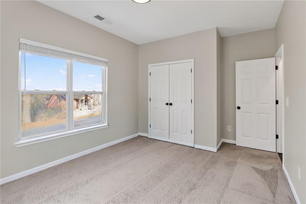 991 Ada Avenue Northwest Atlanta, GA 30318 - Photo 28 of 32 a view of an empty room with a window