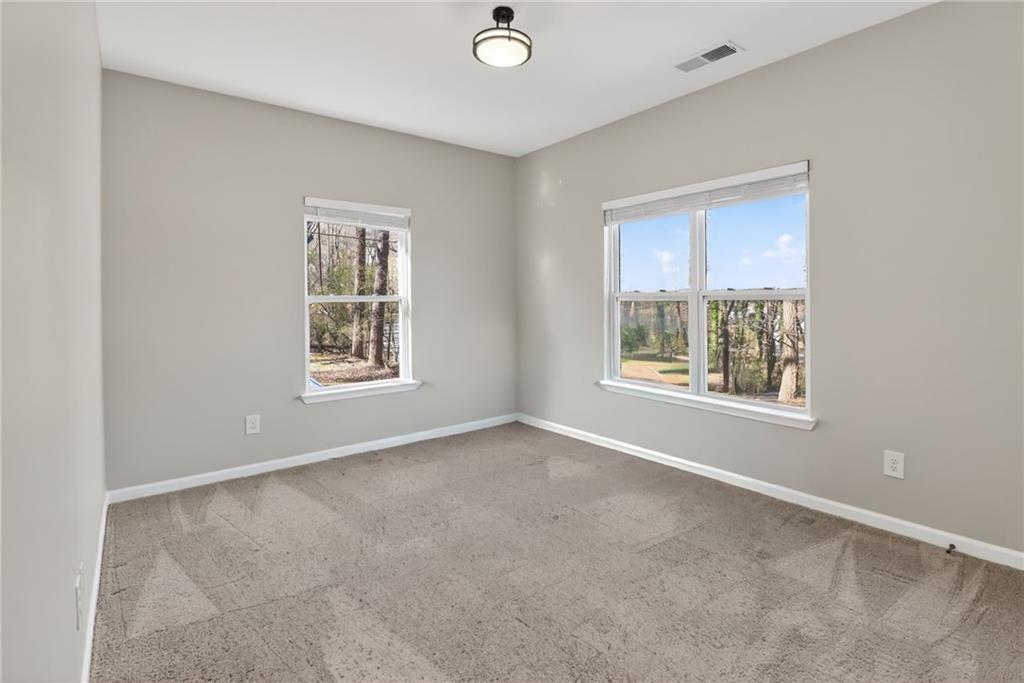 991 Ada Avenue Northwest Atlanta, GA 30318 - Photo 29 of 32 an empty room with windows and closet