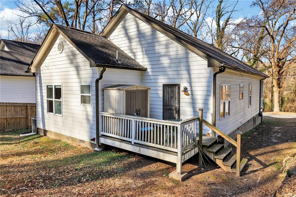 991 Ada Avenue Northwest Atlanta, GA 30318 - Photo 30 of 32 a view of a house with backyard and deck