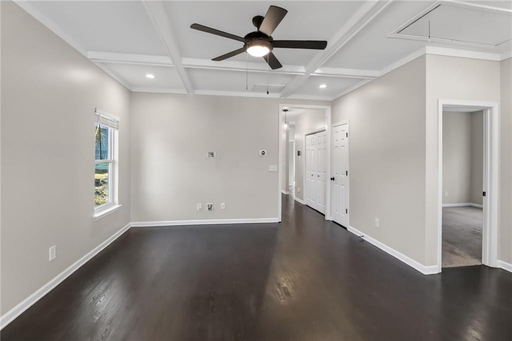 991 Ada Avenue Northwest Atlanta, GA 30318 - Photo 6 of 32 a view of an empty room with wooden floor and a window