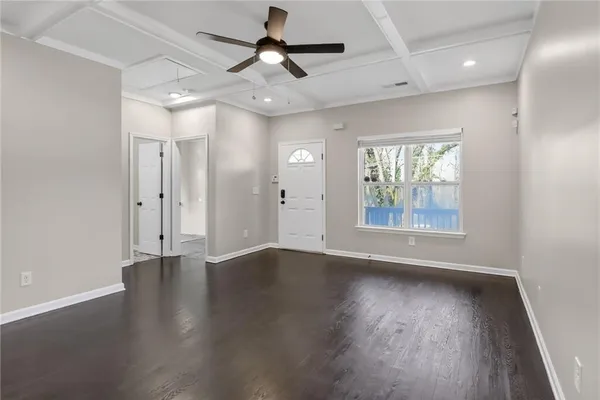 a view of a dining room with furniture and wooden floor