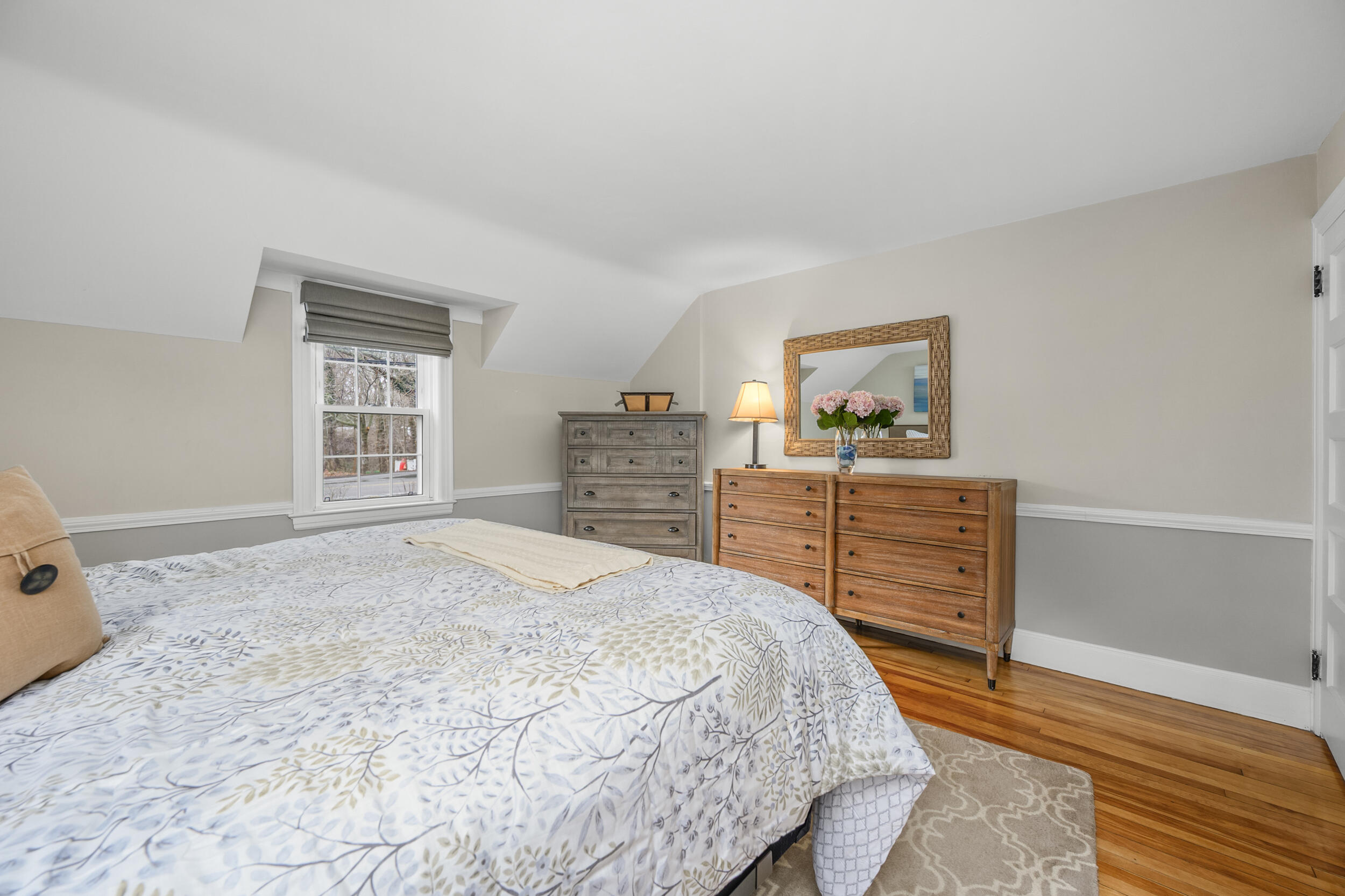442 Pine Street Centerville, MA 02632 - Photo 15 of 43 a bedroom with a bed and a dresser