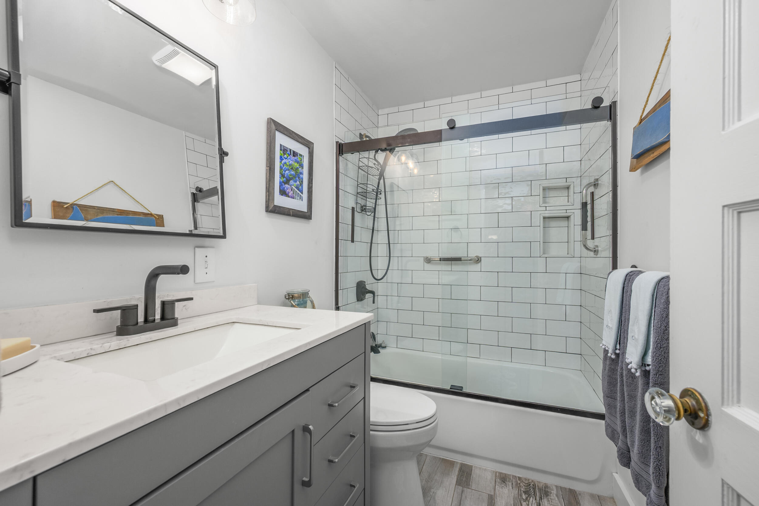442 Pine Street Centerville, MA 02632 - Photo 16 of 43 a bathroom with a sink a toilet and shower