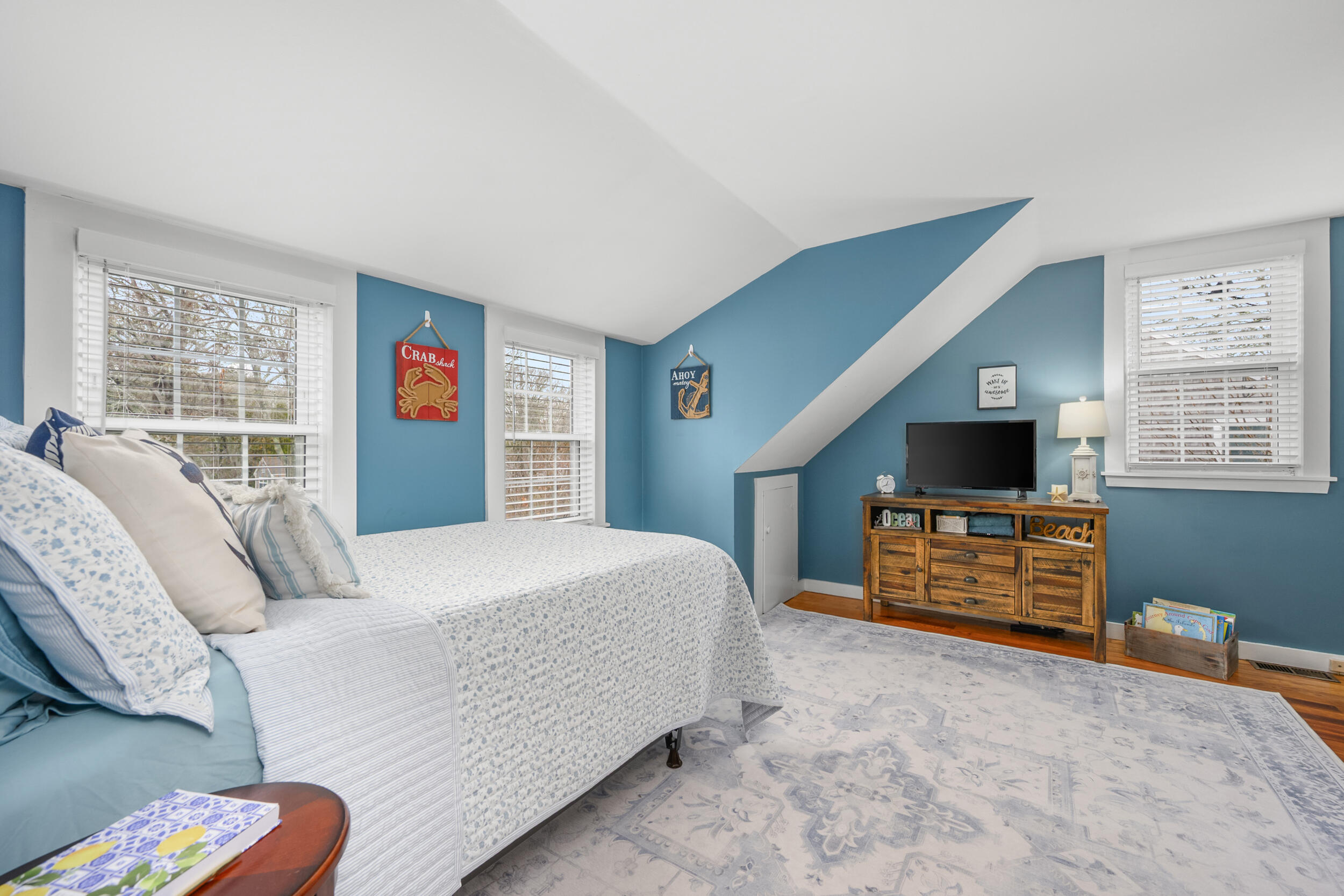 442 Pine Street Centerville, MA 02632 - Photo 19 of 43 a bedroom with a bed and a dresser next to a window