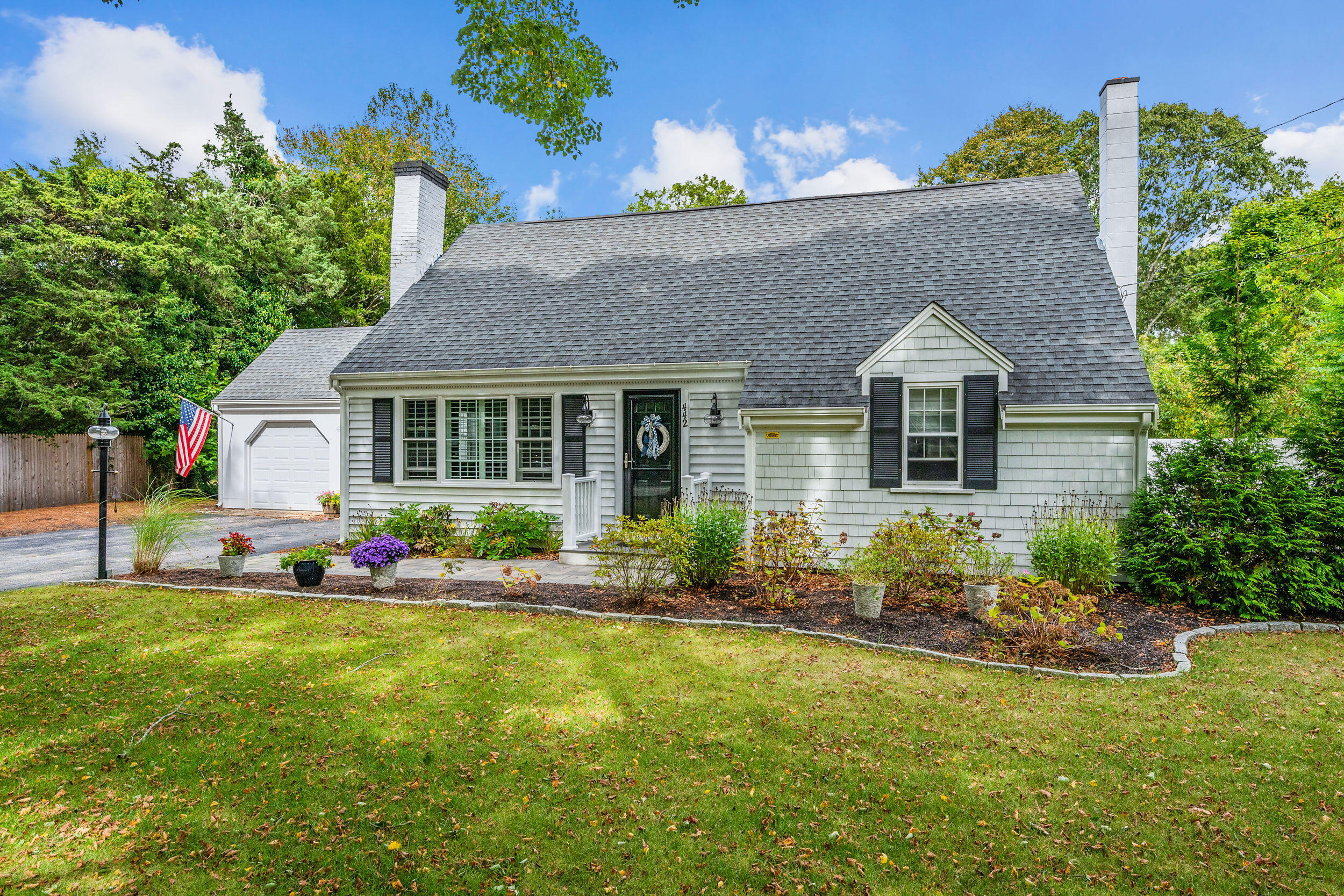 442 Pine Street Centerville, MA 02632 - Photo 2 of 43 a front view of house with yard and outdoor seating