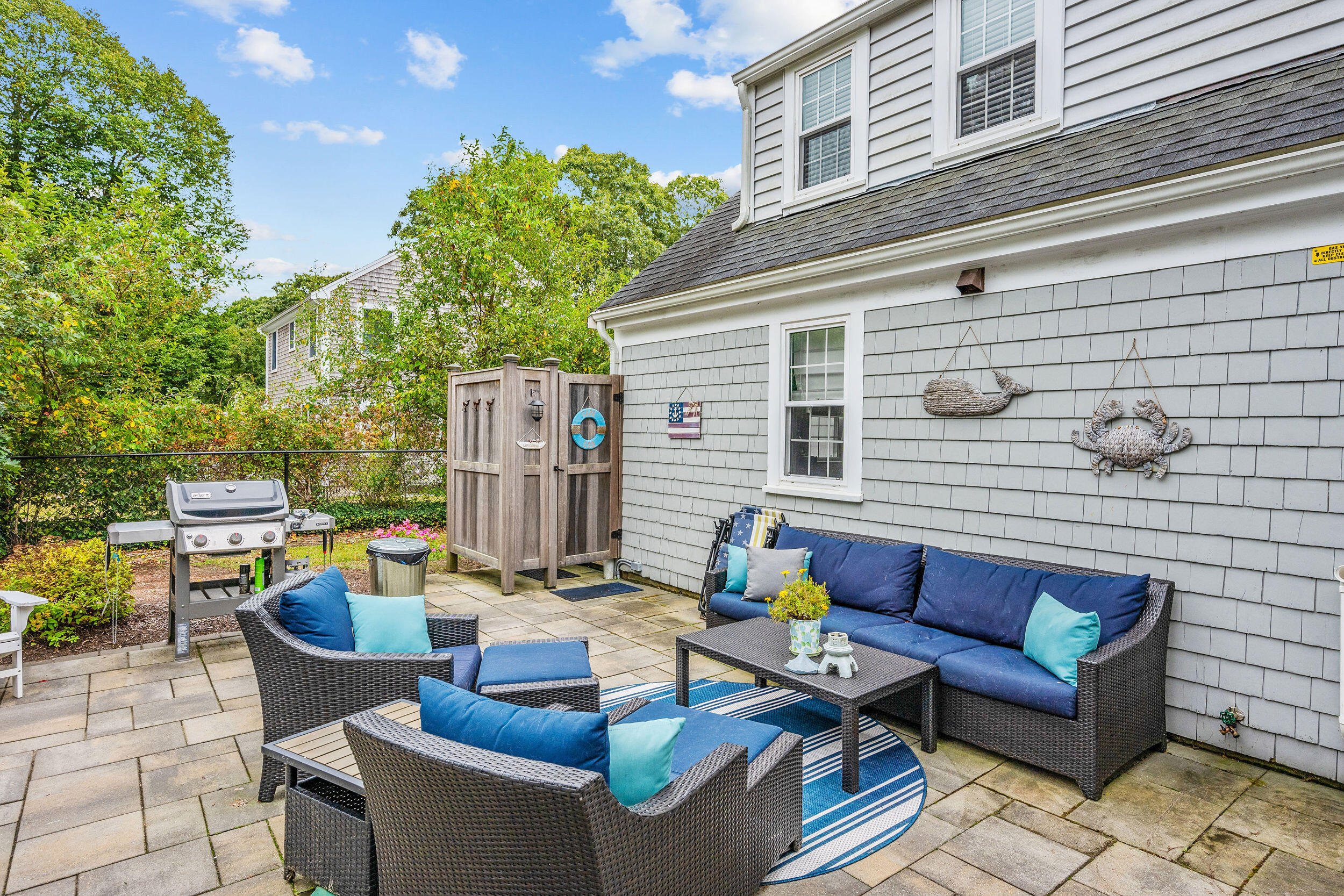 442 Pine Street Centerville, MA 02632 - Photo 26 of 43 a outdoor living space with patio furniture and a potted plant
