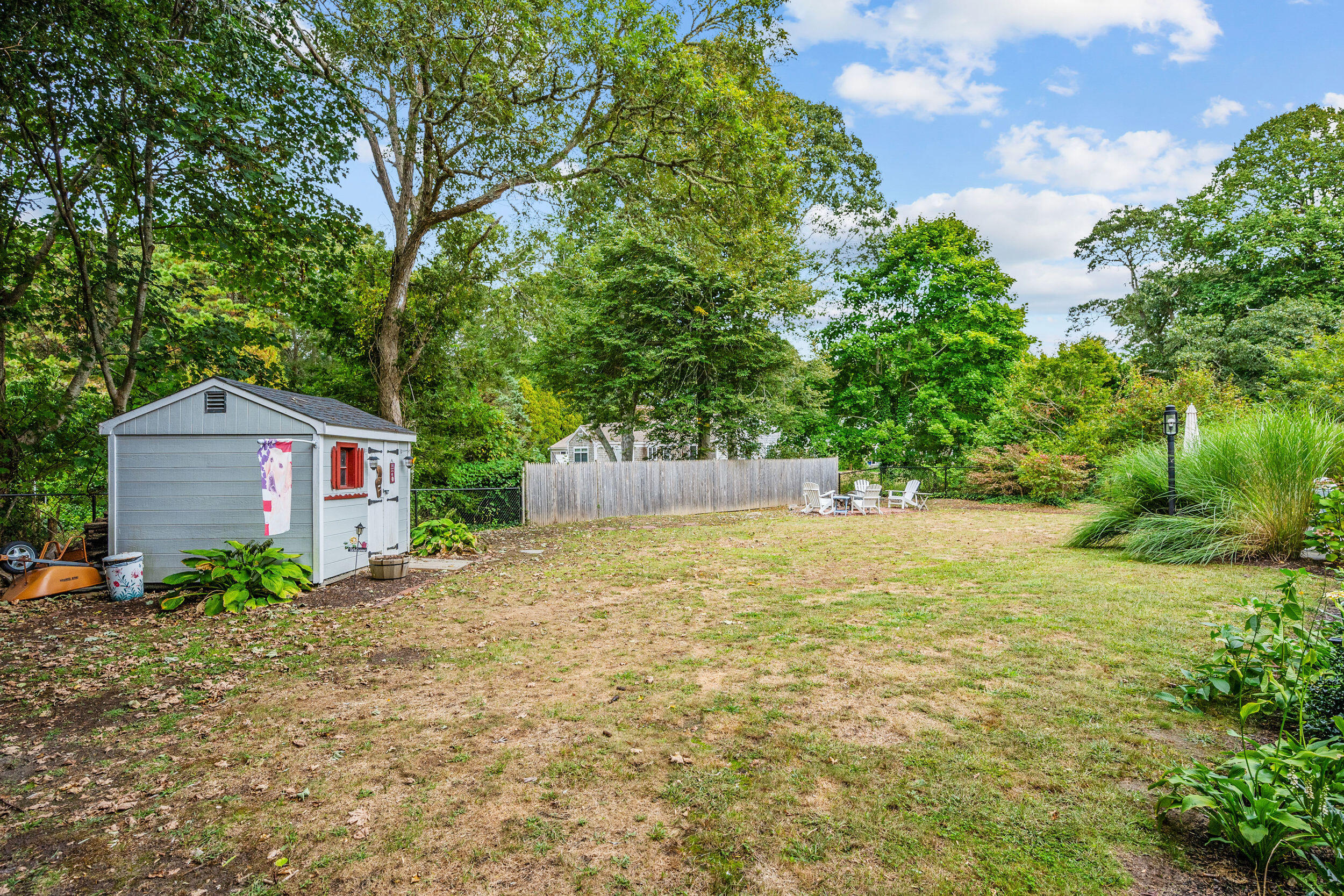 442 Pine Street Centerville, MA 02632 - Photo 30 of 43 a front view of a house with a yard