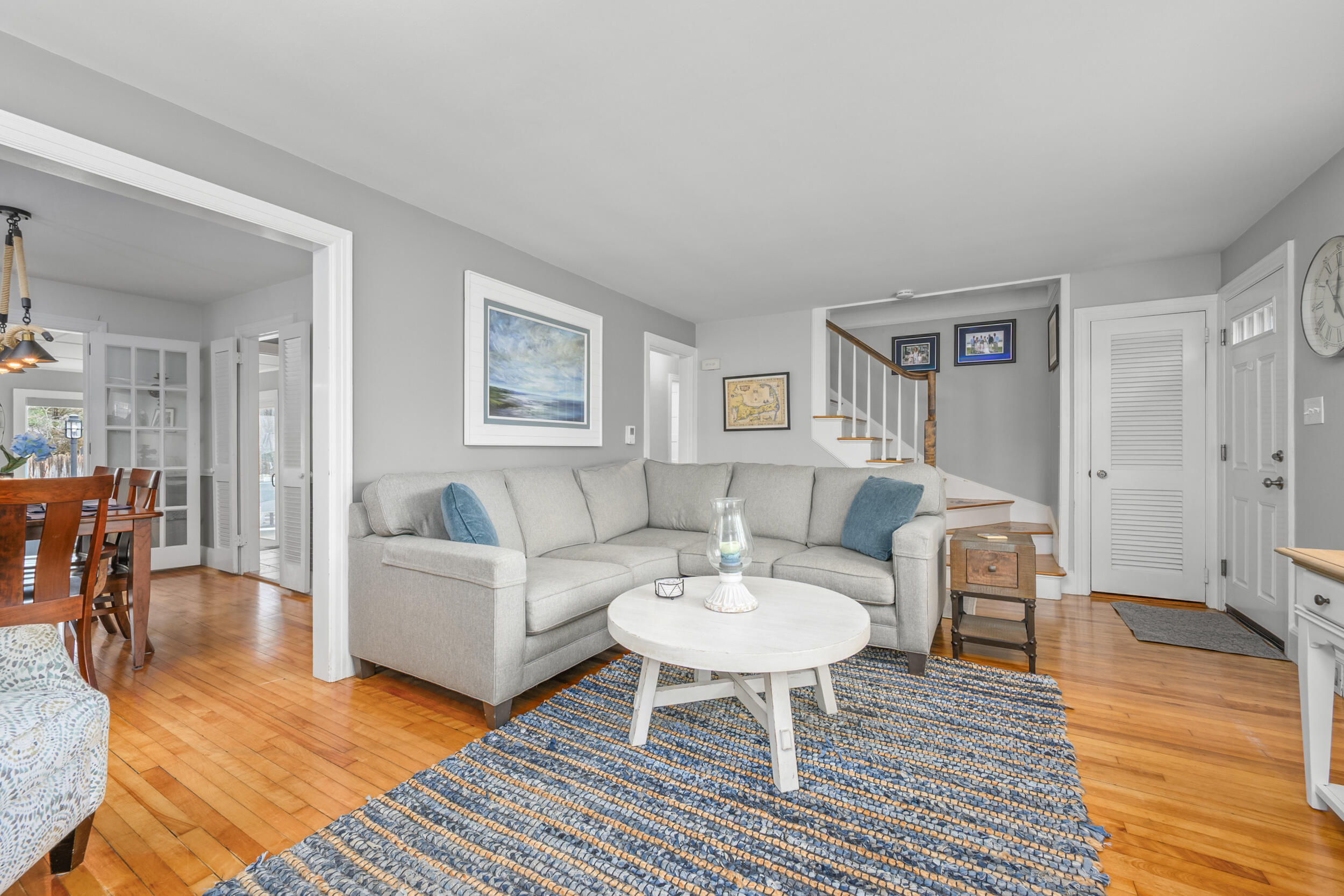 442 Pine Street Centerville, MA 02632 - Photo 7 of 43 a living room with furniture a table and wooden floor