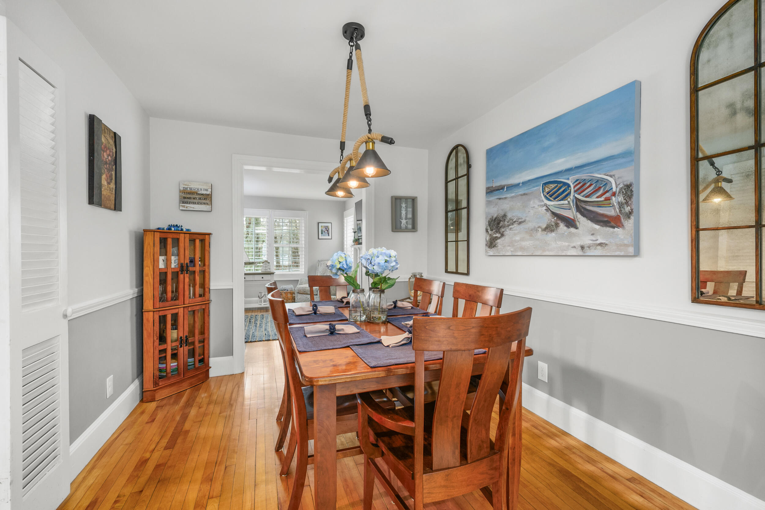 442 Pine Street Centerville, MA 02632 - Photo 9 of 43 a view of a dining room with furniture window and wooden floor