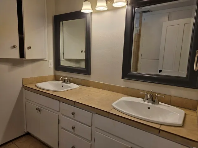 a bathroom with a sink and a mirror
