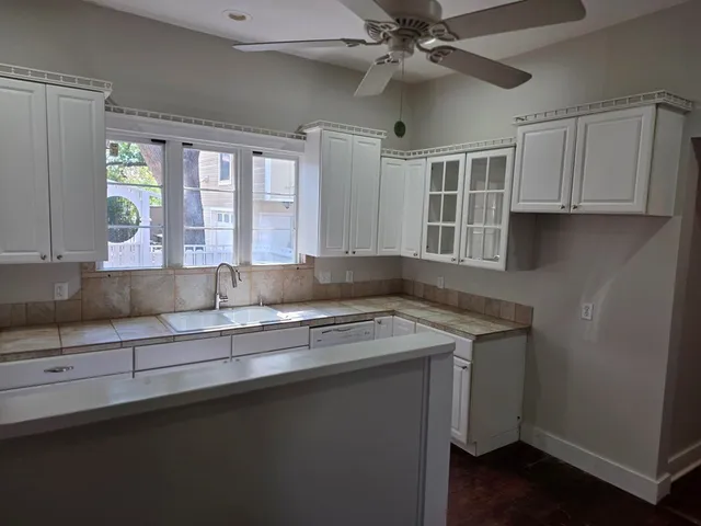 a kitchen with a sink and a window