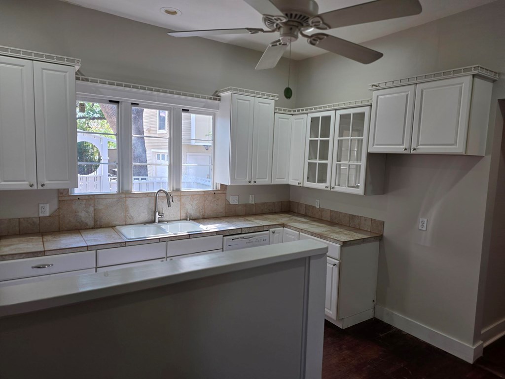 109 West Travis Street, Unit MH Fredericksburg, TX 78624 - Photo 17 of 24 a kitchen with a sink and a window