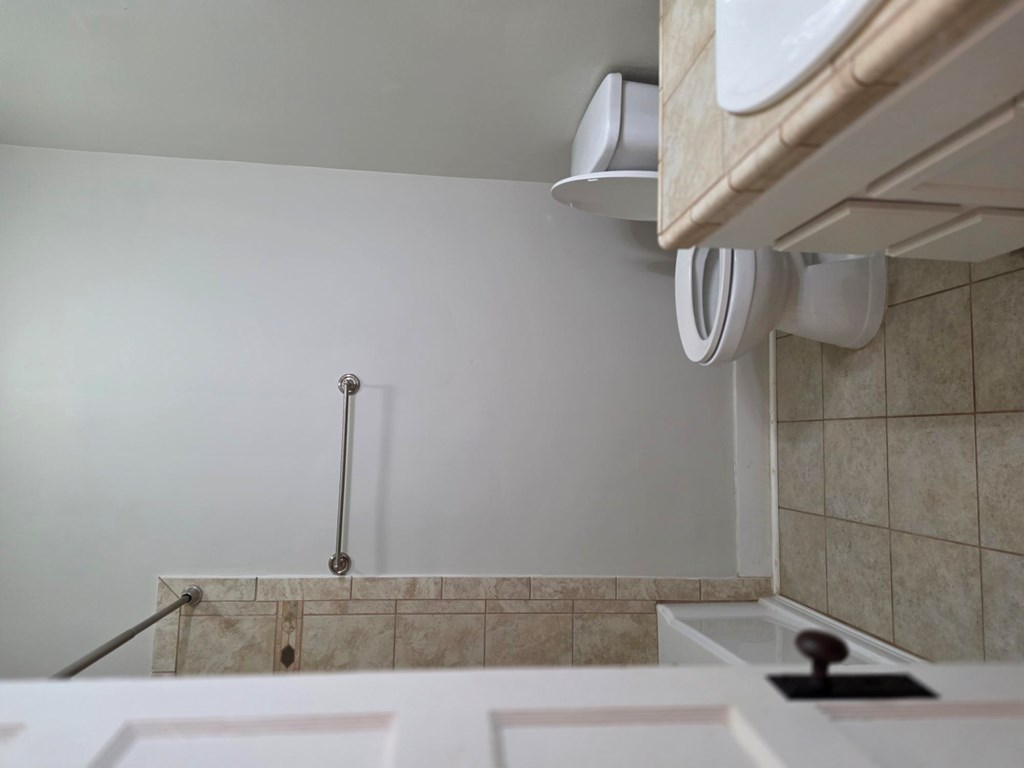 109 West Travis Street, Unit MH Fredericksburg, TX 78624 - Photo 19 of 24 a bathroom with a sink and a bathtub
