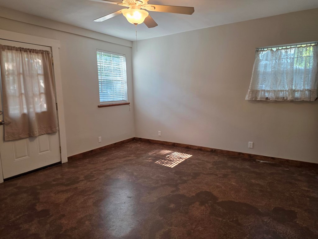 109 West Travis Street, Unit MH Fredericksburg, TX 78624 - Photo 20 of 24 an empty room with a window