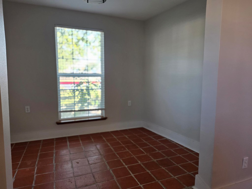 109 West Travis Street, Unit MH Fredericksburg, TX 78624 - Photo 9 of 24 a view of an empty room and window