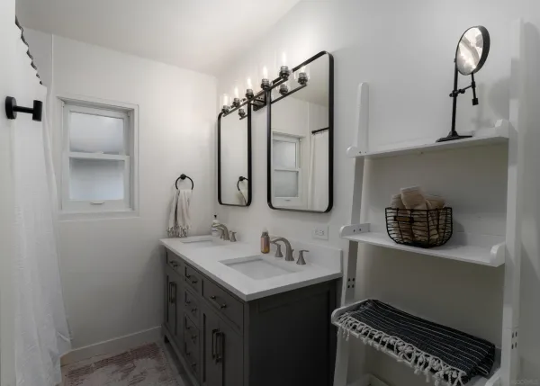 a bathroom with a sink a vanity and a mirror