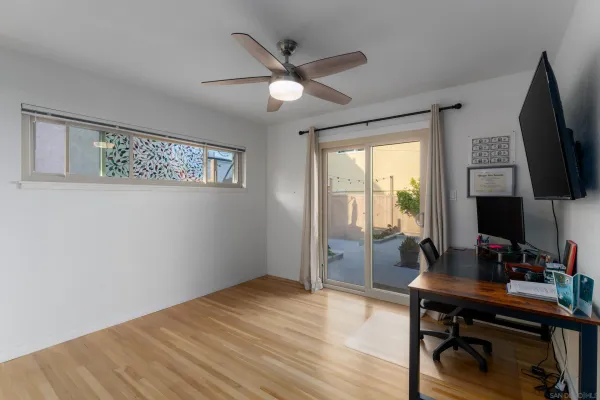 a workspace with furniture hardwood and a window