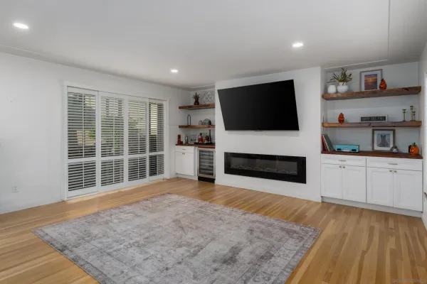 a view of living room with furniture and a flat screen tv