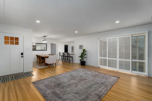 a view of a living room and dining room