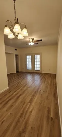 a view of a room with granite countertop furniture and chandelier